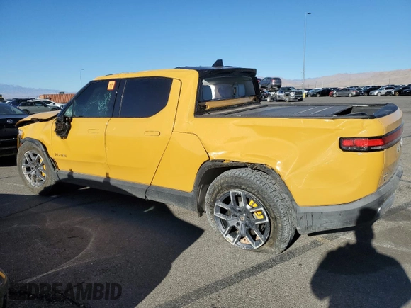 2022 Rivian R1T Launch Edition z VIN 7FCTGAAL2NN011755, wystawiony jako Copart lot #81940684 z przebiegiem Nie podano mil oraz Szkoda całkowita • Salvage title. Historia ofert i sprzedaży dostępna na DreamBid. Obrazek 2.