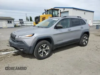 2014 Jeep Cherokee Trailhawk z VIN 1C4PJMBS6EW159174, wystawiony jako Copart lot #56097795 z przebiegiem 130 299 mil mil oraz Szkoda całkowita • Salvage title. Historia ofert i sprzedaży dostępna na DreamBid. Obrazek 1.