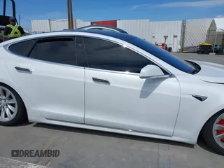 2018 Tesla Model S 75D with VIN 5YJSA1E25JF245269, listed as a IAAI auction lot 41914567 with 56,086 mi miles and . Bid and sale history available at DreamBid. Image 14.
