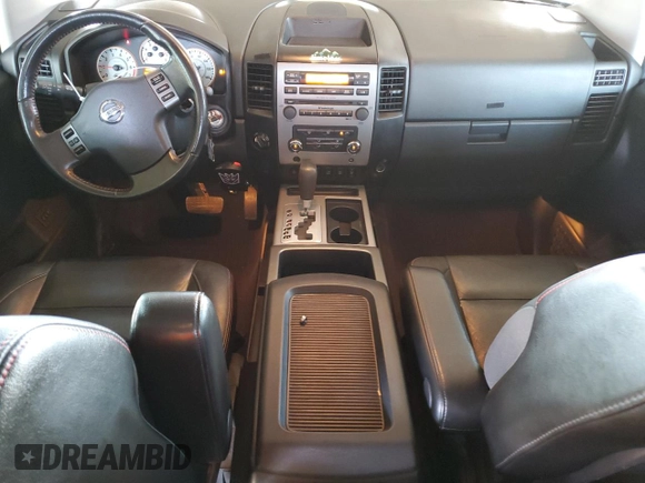 2011 Nissan Titan Pro-4X z VIN 1N6BA0EC9BN304469, wystawiony jako Copart lot #52982815 z przebiegiem 108 829 mil mil oraz Szkoda całkowita • Salvage title. Historia ofert i sprzedaży dostępna na DreamBid. Obrazek 8.