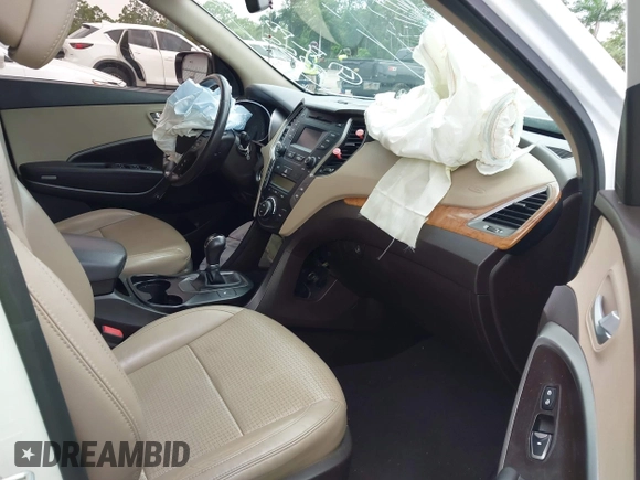 2014 Hyundai Santa Fe with VIN 5XYZU3LB9EG229255, listed as a IAAI auction lot 42407410 with 201,523 mi miles and . Bid and sale history available at DreamBid. Image 5.