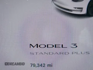 2020 Tesla Model 3 Standard Range Plus with VIN 5YJ3E1EAXLF590591, listed as a IAAI auction lot 42140338 with 79,342 mi miles and . Bid and sale history available at DreamBid. Image 16.