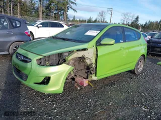 2012 Hyundai Accent GS with VIN KMHCT5AE9CU021238, listed as a IAAI auction lot 41762650 with 166,287 mi miles. Bid and sale history available at carsss.com. Image 2.