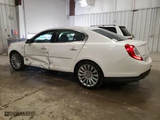 2014 Lincoln MKS with VIN 1LNHL9EK2EG605964, listed as a Copart auction lot 51810195 with 102,850 mi miles and Non Repairable. Bid and sale history available at carsss.com. Image 2.