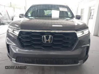 2025 Honda Pilot EX-L z VIN 5FNYG2H40SB019525, wystawiony jako IAAI lot #42190029 z przebiegiem 10 794 mil mil oraz . Historia ofert i sprzedaży dostępna na DreamBid. Obrazek 13.