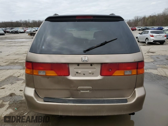 2004 Honda Odyssey EX with VIN 5FNRL186X4B127827, listed as a Copart auction lot 51602565 with 182,127 mi miles and Salvage Title. Bid and sale history available at DreamBid. Image 6.