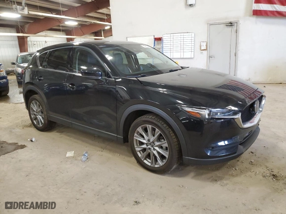 2021 Mazda CX-5 Grand Touring Reserve with VIN JM3KFBAY7M0308125, listed as a Copart auction lot 49658085 with 76,470 mi miles and Clean Title. Bid and sale history available at carsss.com. Image 4.
