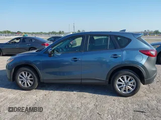 2016 Mazda CX-5 Sport with VIN JM3KE2BY8G0864983, listed as a IAAI auction lot 42072385 with 141,104 mi miles. Bid and sale history available at carsss.com. Image 14.