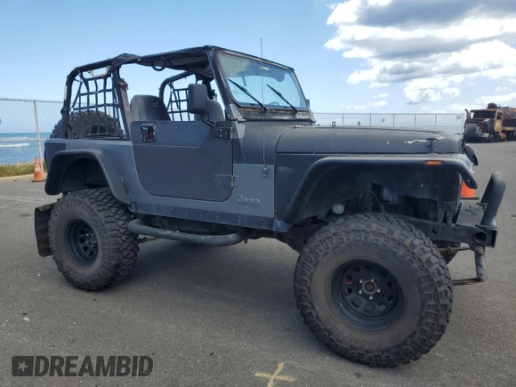 1990 Jeep Wrangler with VIN 2J4FY29T5LJ537896, listed as a Copart auction lot 57021295 with 143,753 mi miles and Clean title. Bid and sale history available at DreamBid. Image 4.