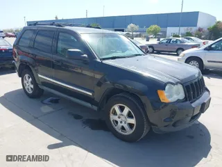 2010 Jeep Grand Cherokee Laredo with VIN 1J4PR4GK2AC104857, listed as a IAAI auction lot 42009569 with 131,986 mi miles. Bid and sale history available at carsss.com. Image 1.