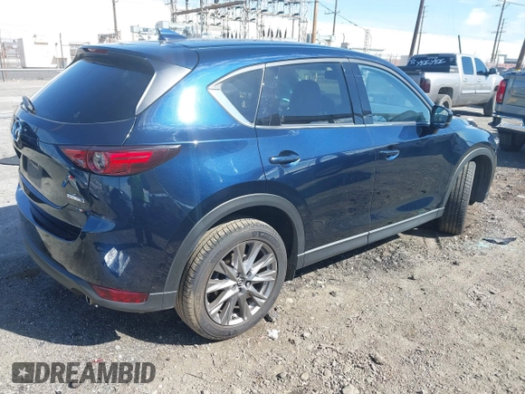 2020 Mazda CX-5 Grand Touring with VIN JM3KFBDM8L0807555, listed as a IAAI auction lot 41612906 with 40,518 mi miles. Bid and sale history available at carsss.com. Image 4.