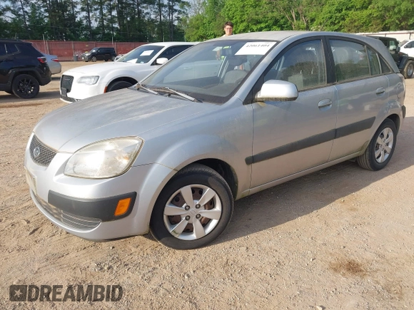 2009 Kia Rio LX with VIN KNADE243896483683, listed as a IAAI auction lot 42061404 with 88,614 mi miles. Bid and sale history available at carsss.com. Image 2.