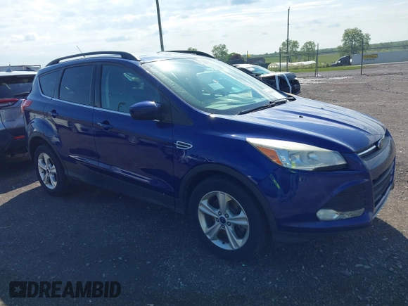 2014 Ford Escape SE with VIN 1FMCU9GX1EUB52373, listed as a IAAI auction lot 42163933 with 128,634 mi miles. Bid and sale history available at carsss.com. Image 1.