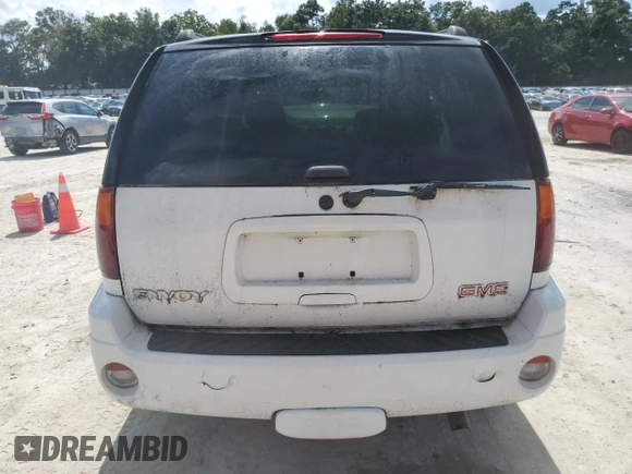 2005 GMC Envoy SLT with VIN 1GKDT13S052311455, listed as a Copart auction lot 73635434 with Not Provided miles and Salvage Title. Bid and sale history available at DreamBid. Image 6.