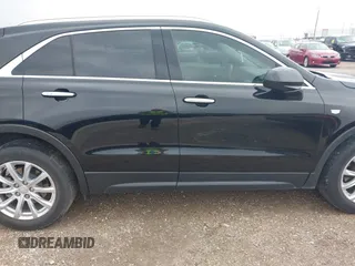 2020 Cadillac XT4 FWD Luxury z VIN 1GYAZAR4XLF146598, wystawiony jako IAAI lot #42211317 z przebiegiem 37 313 mil mil oraz . Historia ofert i sprzedaży dostępna na DreamBid. Obrazek 13.