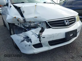 2004 Honda Odyssey EX-L with VIN 5FNRL18924B064040, listed as a IAAI auction lot 41350306 with 130,803 mi miles and . Bid and sale history available at DreamBid. Image 15.