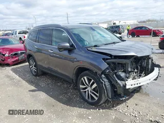 2017 Honda Pilot Touring with VIN 5FNYF6H92HB036406, listed as a IAAI auction lot 41949223 with 147,462 mi miles. Bid and sale history available at carsss.com. Image 1.