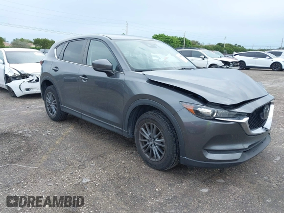 2021 Mazda CX-5 Touring with VIN JM3KFACM1M0461510, listed as a IAAI auction lot 41660439 with 30,352 mi miles. Bid and sale history available at carsss.com. Image 1.
