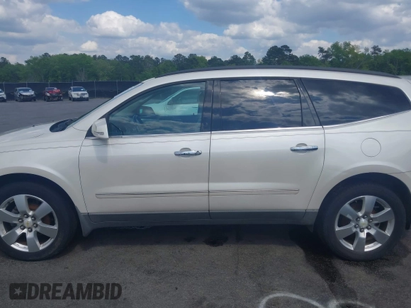 2011 Chevrolet Traverse LTZ with VIN 1GNKVLED5BJ167465, listed as a IAAI auction lot 42002979 with 167,271 mi miles and . Bid and sale history available at DreamBid. Image 14.