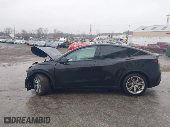 2021 Tesla Model Y Standard Range with VIN 5YJYGDED9MF103989, listed as a IAAI auction lot 41482268 with 33,485 mi miles and . Bid and sale history available at DreamBid. Image 15.
