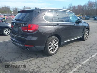 2014 BMW X5 xDrive35i with VIN 5UXKR0C57E0H20944, listed as a IAAI auction lot 42011451 with 208,205 mi miles. Bid and sale history available at carsss.com. Image 4.