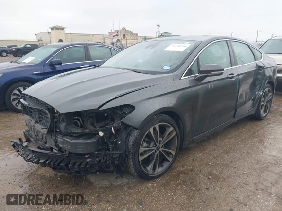 2020 Ford Fusion Titanium with VIN 3FA6P0K97LR192657, listed as a IAAI auction lot 42170258 with 87,696 mi miles and . Bid and sale history available at DreamBid. Image 19.