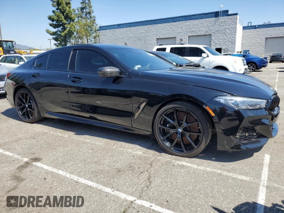 2022 BMW 8 Series M850i with VIN WBAGV8C02NCK08667, listed as a Copart auction lot 50335155 with 22,737 mi miles and Salvage title. Bid and sale history available at DreamBid. Image 4.