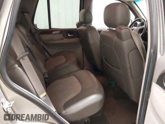 2004 GMC Envoy SLE with VIN 1GKDT13S042243883, listed as a IAAI auction lot 41795335 with 162,873 mi miles. Bid and sale history available at carsss.com. Image 8.