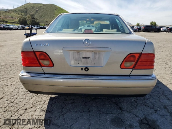 1997 Mercedes-Benz E-Class with VIN WDBJF55F4VJ032270, listed as a Copart auction lot 48010725 with 191,091 mi miles and Salvage Title. Bid and sale history available at carsss.com. Image 6.