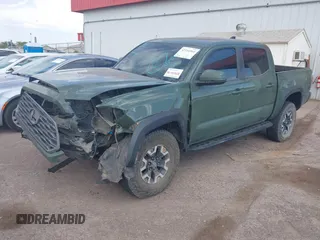 2021 Toyota Tacoma SR z VIN 3TYCZ5AN2MT049069, wystawiony jako IAAI lot #42116964 z przebiegiem 96 275 mil mil oraz . Historia ofert i sprzedaży dostępna na DreamBid. Obrazek 2.