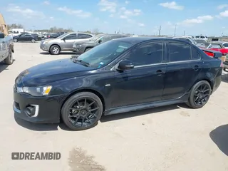 2016 Mitsubishi Lancer GT with VIN JA32U8FW8GU011501, listed as a IAAI auction lot 41779016 with 153,082 mi miles. Bid and sale history available at carsss.com. Image 14.