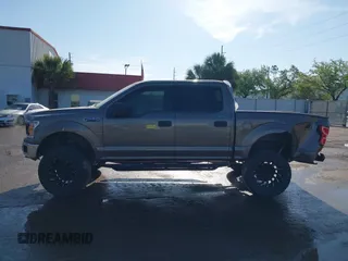 2018 Ford F-150 XL with VIN 1FTEW1EG1JFC31794, listed as a IAAI auction lot 41304111 with 129,058 mi miles and . Bid and sale history available at carsss.com. Image 14.