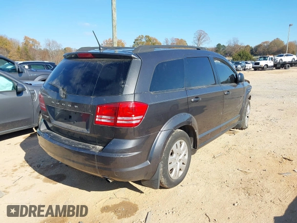 2018 Dodge Journey SE with VIN 3C4PDCABXJT183318, listed as a IAAI auction lot 40985444 with 164,051 mi miles. Bid and sale history available at carsss.com. Image 4.