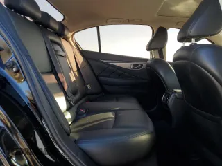 2015 Infiniti Q50 Premium with VIN JN1BV7ARXFM423673, listed as a Copart auction lot 47127065 with 112,692 mi miles and Clean Title. Bid and sale history available at carsss.com. Image 10.