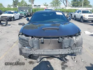 2019 Dodge Charger R/T z VIN 2C3CDXCT7KH527732, wystawiony jako IAAI lot #42283453 z przebiegiem 99 755 mil mil oraz . Historia ofert i sprzedaży dostępna na DreamBid. Obrazek 13.