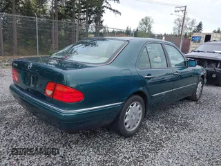 1998 Mercedes-Benz E-Class with VIN WDBJF65FXWA589630, listed as a IAAI auction lot 41990725 with 102,149 mi miles. Bid and sale history available at carsss.com. Image 4.