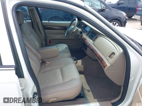2004 Mercury Grand Marquis GS z VIN 2MEFM74W54X654116, wystawiony jako IAAI lot #41875021 z przebiegiem 129 999 mil mil oraz . Historia ofert i sprzedaży dostępna na DreamBid. Obrazek 5.