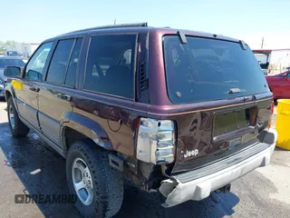 1997 Jeep Grand Cherokee TSi with VIN 1J4FX58S2VC747897, listed as a IAAI auction lot 42033868 with 119,924 mi miles. Bid and sale history available at carsss.com. Image 3.