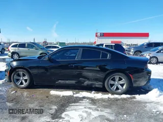 2015 Dodge Charger SXT with VIN 2C3CDXHG5FH841090, listed as a IAAI auction lot 41293591 with 107,732 mi miles and . Bid and sale history available at DreamBid. Image 14.