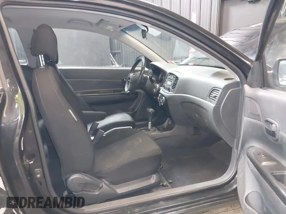 2007 Hyundai Accent SE with VIN KMHCN36C67U026540, listed as a IAAI auction lot 41062633 with 70,143 mi miles. Bid and sale history available at carsss.com. Image 5.