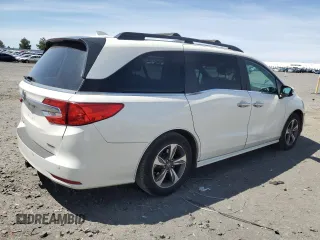 2018 Honda Odyssey Touring with VIN 5FNRL6H8XJB018438, listed as a Copart auction lot 61876505 with 104,581 mi miles and Salvage title. Bid and sale history available at DreamBid. Image 3.