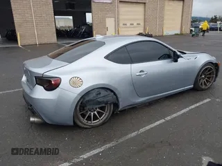 2016 Scion FR-S with VIN JF1ZNAA1XG8709798, listed as a IAAI auction lot 41713314 with 139,450 mi miles. Bid and sale history available at carsss.com. Image 4.