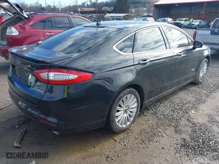 2014 Ford Fusion Energi Titanium with VIN 3FA6P0SU5ER269923, listed as a IAAI auction lot 41086950 with 135,351 mi miles. Bid and sale history available at carsss.com. Image 4.