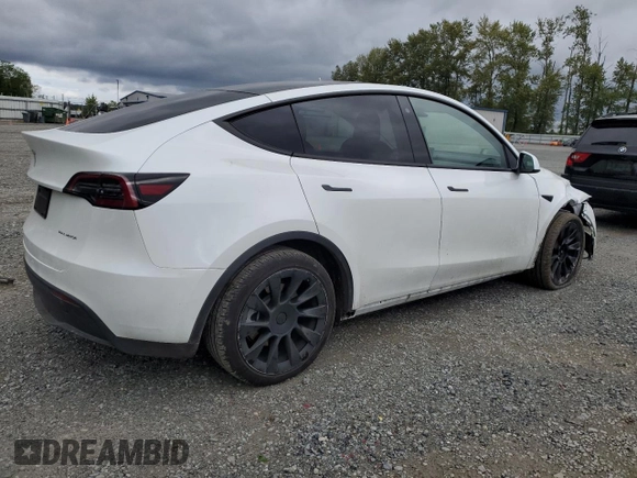 2023 Tesla Model Y Long Range z VIN 7SAYGDEE3PF751019, wystawiony jako Copart lot #57972885 z przebiegiem 24 591 mil mil oraz Szkoda całkowita • Salvage title. Historia ofert i sprzedaży dostępna na DreamBid. Obrazek 3.
