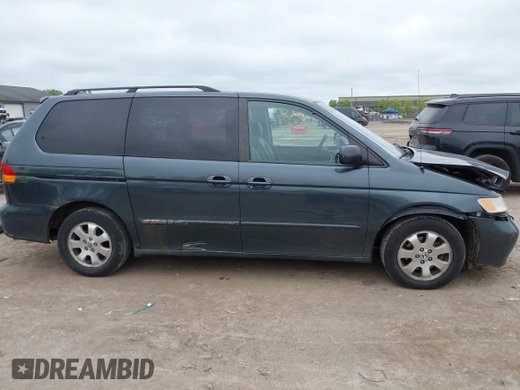 2003 Honda Odyssey EX-L z VIN 5FNRL18053B133092, wystawiony jako IAAI lot #42365081 z przebiegiem 239 753 mil mil oraz . Historia ofert i sprzedaży dostępna na DreamBid. Obrazek 13.