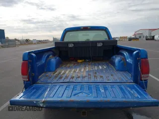1999 Dodge Dakota with VIN 1B7GG26X5XS296142, listed as a IAAI auction lot 41486667 with 185,436 mi miles and . Bid and sale history available at carsss.com. Image 8.