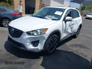 2016 Mazda CX-5 Grand Touring z VIN JM3KE2DY2G0824802, wystawiony jako IAAI lot #42170591 z przebiegiem 53 173 mil mil oraz . Historia ofert i sprzedaży dostępna na DreamBid. Obrazek 2.
