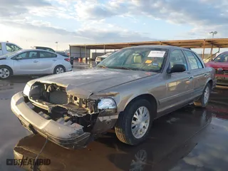 2005 Ford Crown Victoria LX with VIN 2FAFP74W55X130190, listed as a IAAI auction lot 41138306 with 122,738 mi miles. Bid and sale history available at carsss.com. Image 18.