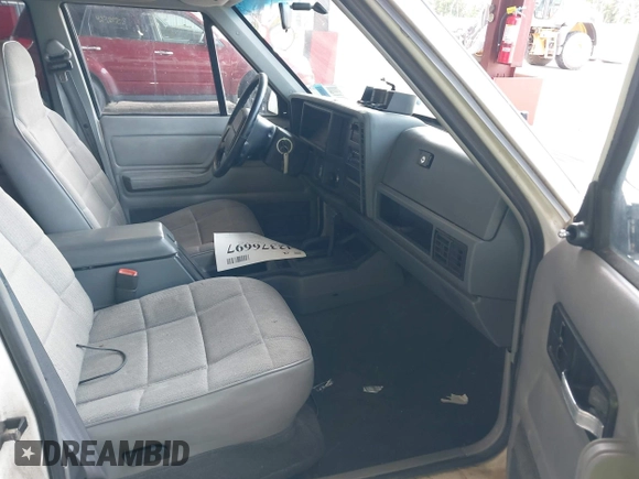 1996 Jeep Cherokee Sport with VIN 1J4FJ68S5TL259449, listed as a IAAI auction lot 42376697 with 72,835 mi miles and . Bid and sale history available at DreamBid. Image 5.