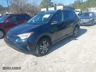 2017 Toyota RAV4 LE with VIN JTMZFREV9HJ719316, listed as a IAAI auction lot 41497253 with 98,357 mi miles. Bid and sale history available at carsss.com. Image 2.